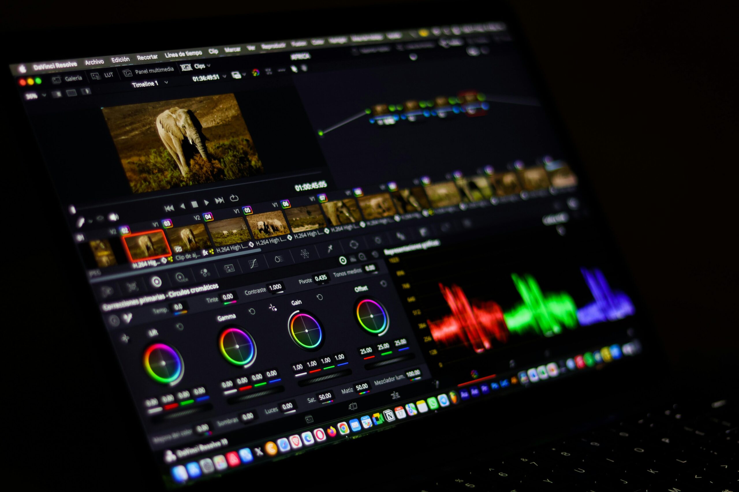 Home Close-up view of professional video editing software displaying colorful waveforms.