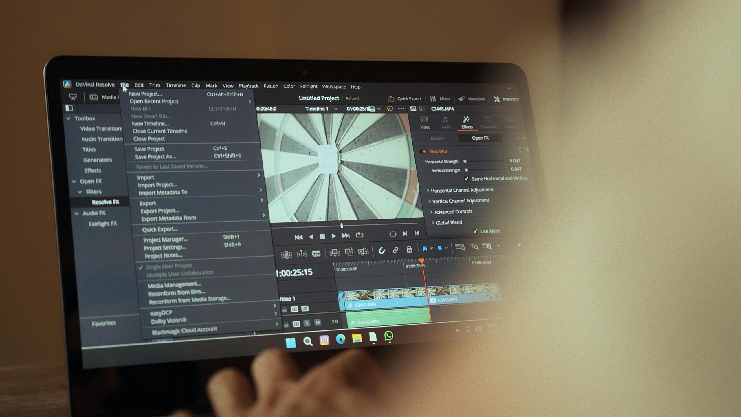 Home Laptop displaying video editing software interface for cinematic storytelling.